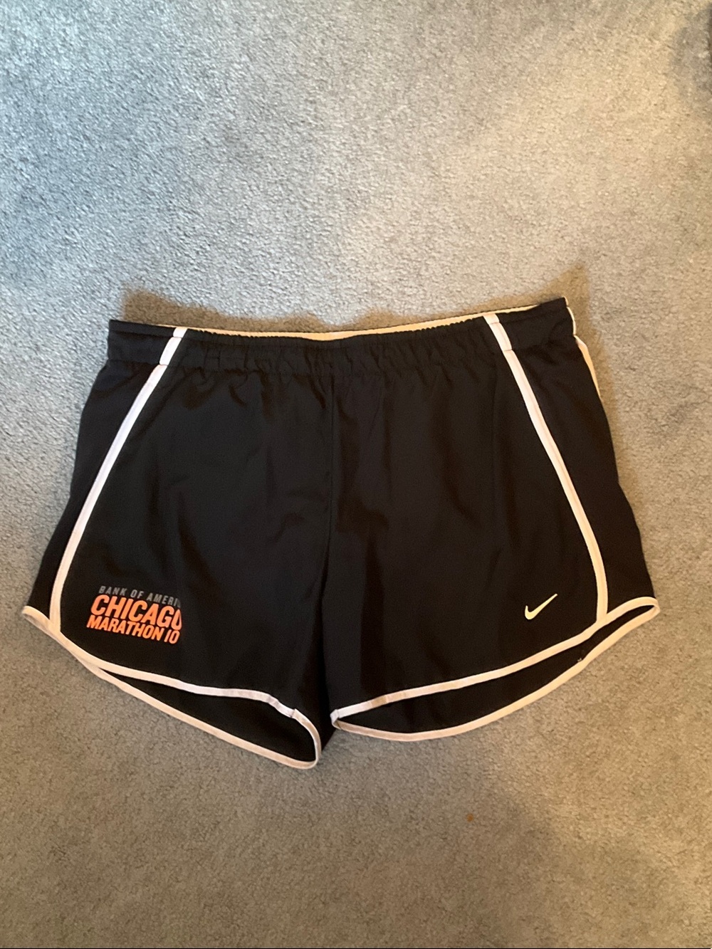 Nike Women’s Black Running Shorts with White Trim and Orange Logo